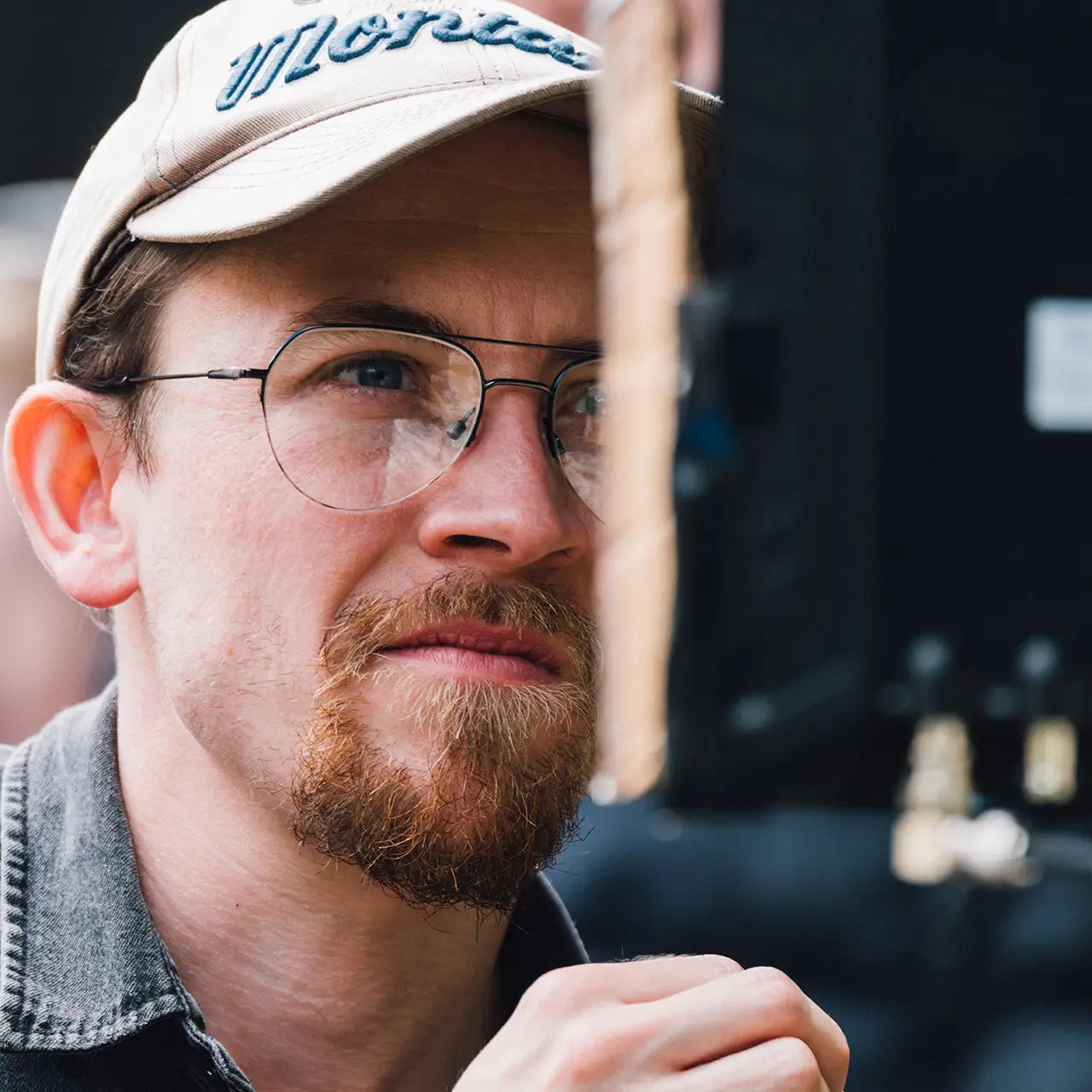 director Thomas Pollock looking at a monitor