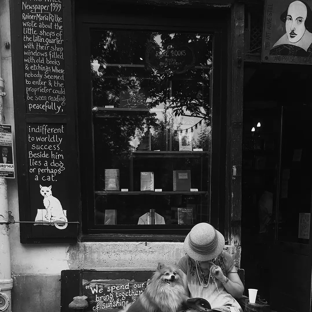 Woman sitting at cafe in Paris
